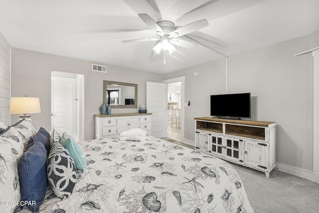 bedroom with light carpet and ceiling fan