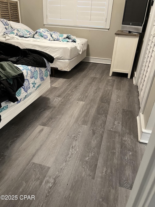 bedroom featuring dark hardwood / wood-style floors