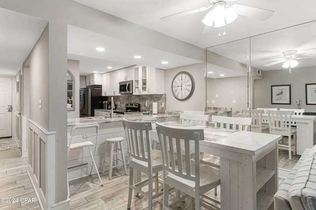 dining room featuring ceiling fan