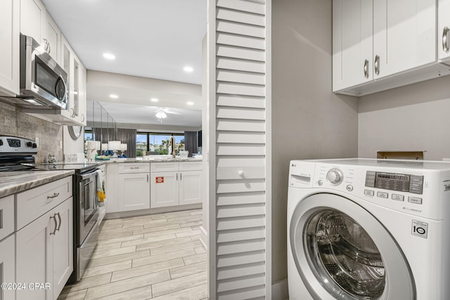 laundry area with washer / dryer