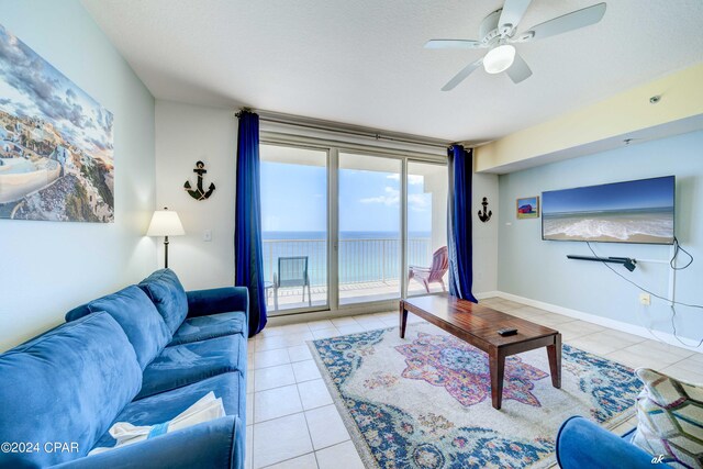 tiled living room with ceiling fan