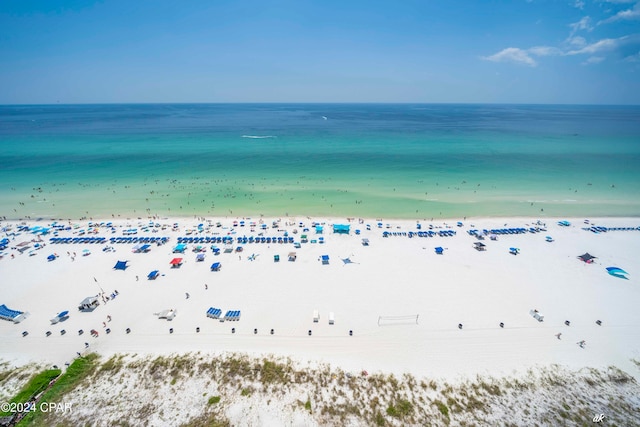 drone / aerial view featuring a view of the beach and a water view