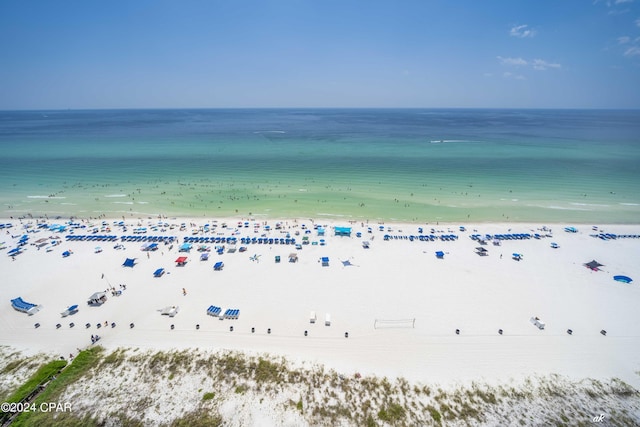 bird's eye view featuring a water view and a beach view