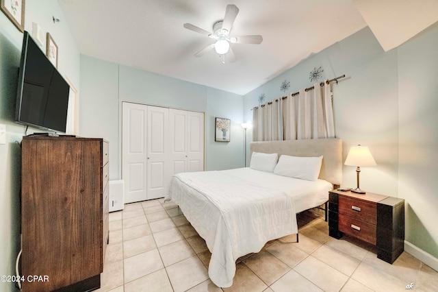 tiled bedroom with a closet and ceiling fan