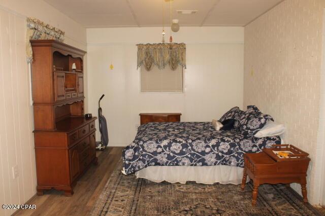 bedroom featuring dark hardwood / wood-style flooring