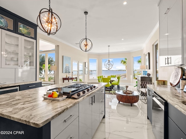 kitchen featuring dishwashing machine, a center island, decorative light fixtures, and stainless steel gas stovetop