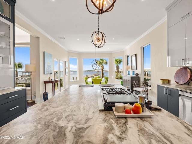 kitchen featuring a notable chandelier, crown molding, and hanging light fixtures