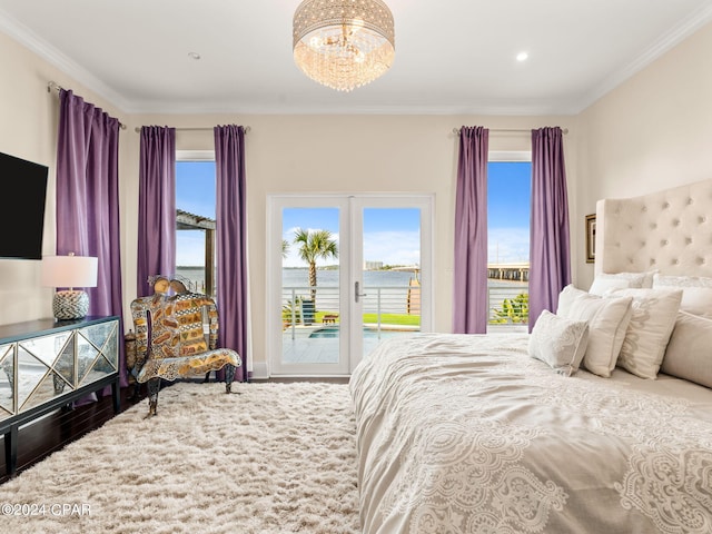 bedroom with a chandelier, access to outside, ornamental molding, and a water view