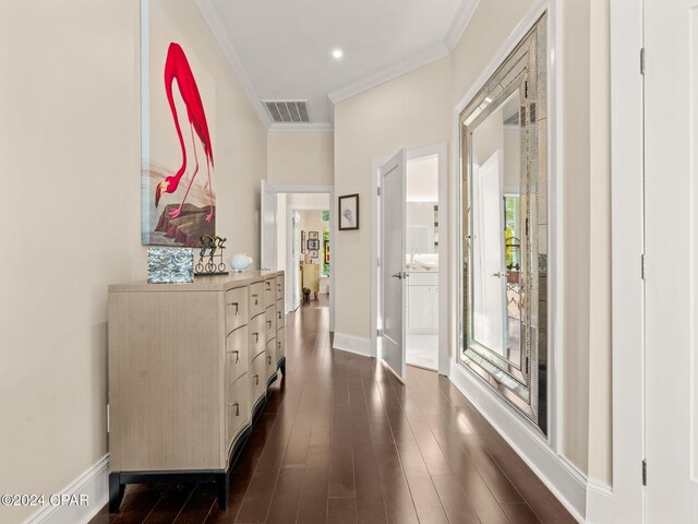 corridor with ornamental molding and dark hardwood / wood-style floors