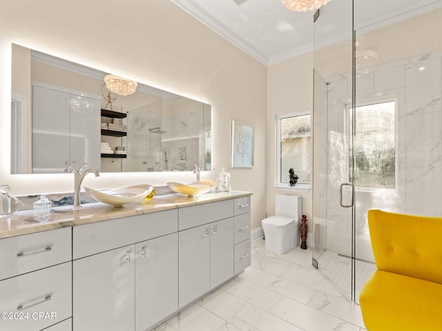 bathroom featuring toilet, vanity, marble finish floor, a shower stall, and crown molding