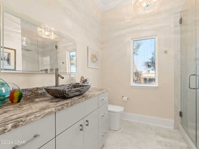 bathroom featuring tile patterned floors, an enclosed shower, vanity, a healthy amount of sunlight, and toilet