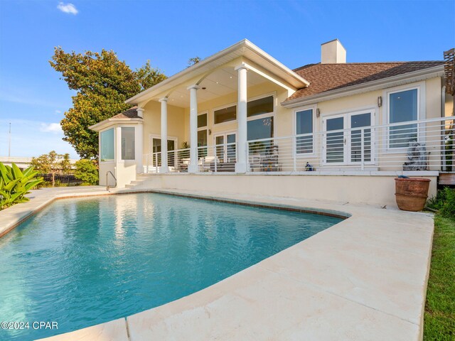 view of swimming pool with a patio area