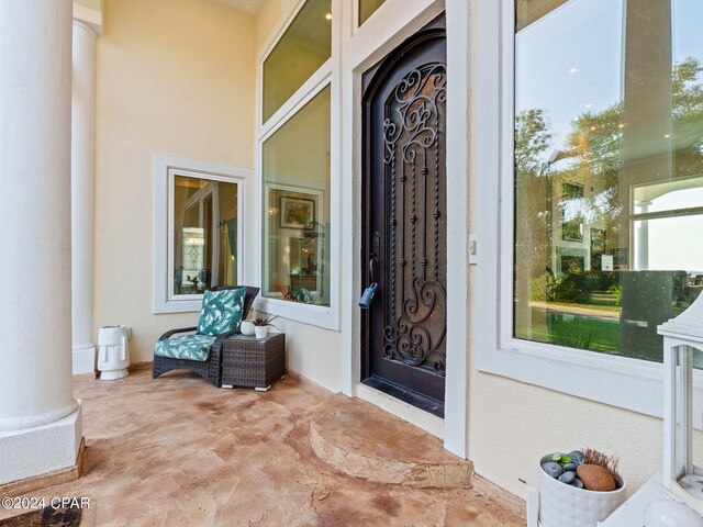 property entrance featuring a patio area