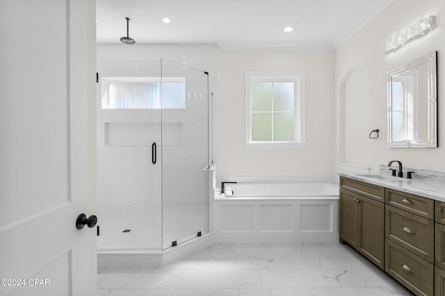 bathroom featuring ornamental molding, vanity, and separate shower and tub