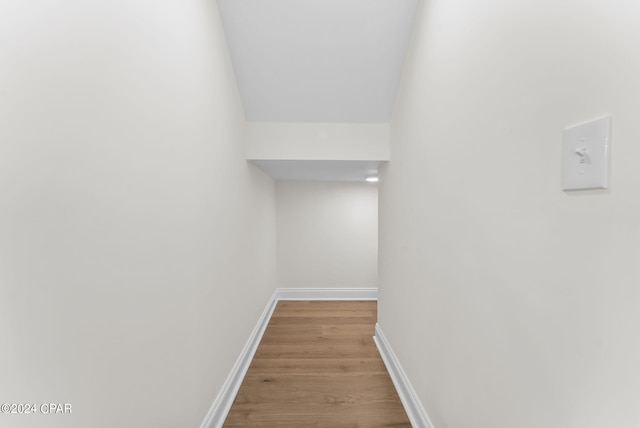 hallway with light hardwood / wood-style flooring