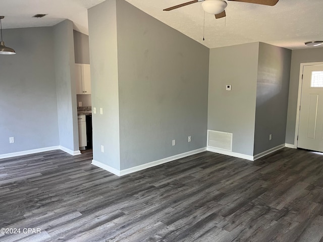 unfurnished living room featuring hardwood / wood-style flooring, a textured ceiling, and ceiling fan