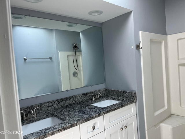 bathroom with vanity and walk in shower