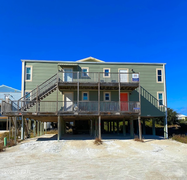 view of front of property featuring a carport