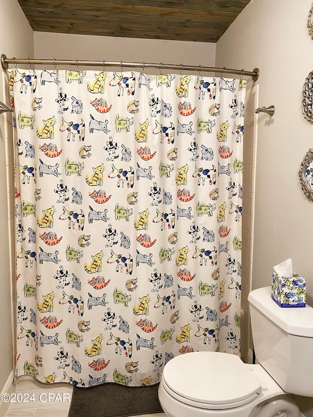 bathroom featuring walk in shower, tile patterned floors, toilet, and wood ceiling