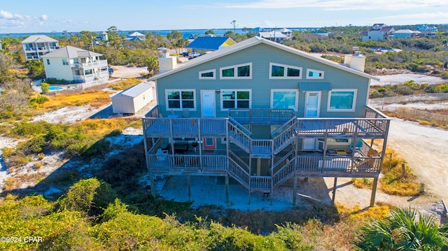 back of property featuring a wooden deck