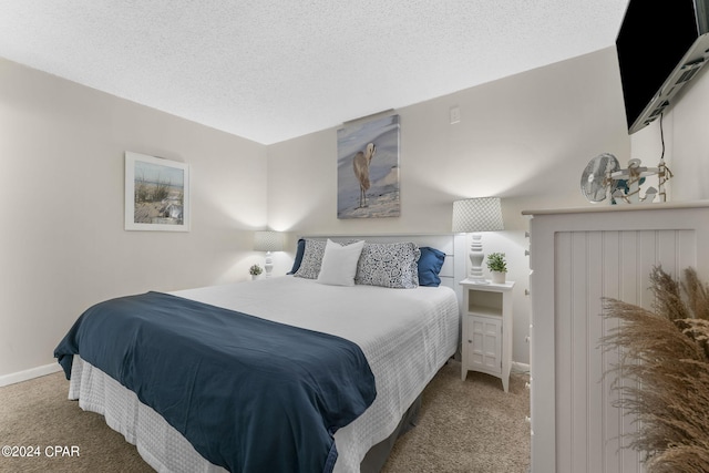 carpeted bedroom with a textured ceiling