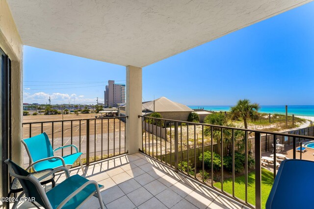 balcony featuring a water view