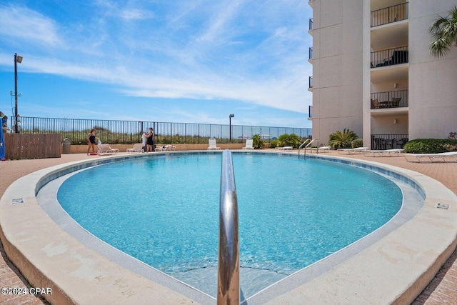 view of pool with fence