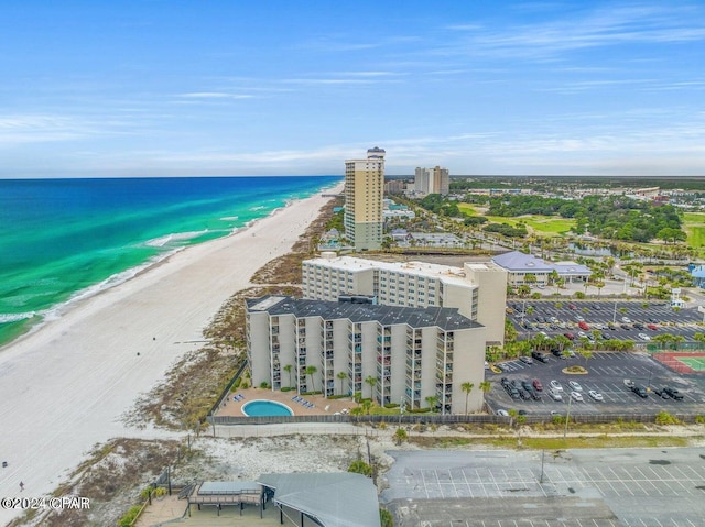 birds eye view of property featuring a view of the beach and a water view