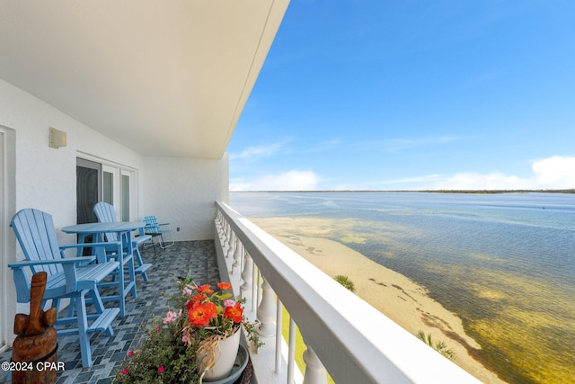 balcony featuring a water view