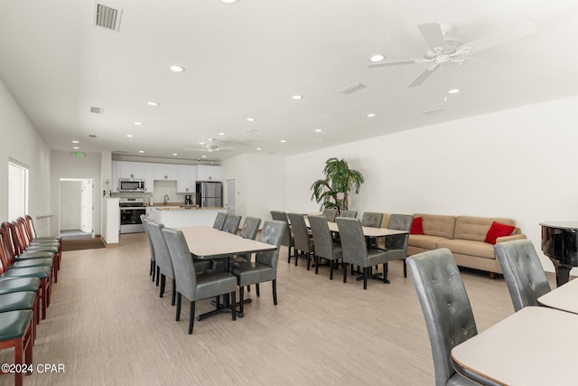 dining space with recessed lighting, visible vents, ceiling fan, and light wood finished floors