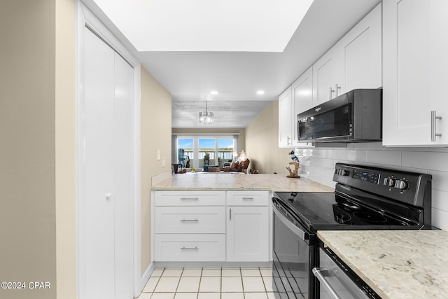 kitchen with black appliances, white cabinetry, decorative backsplash, and light stone counters