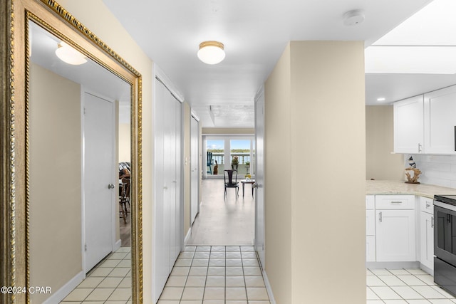 hallway featuring light tile patterned flooring