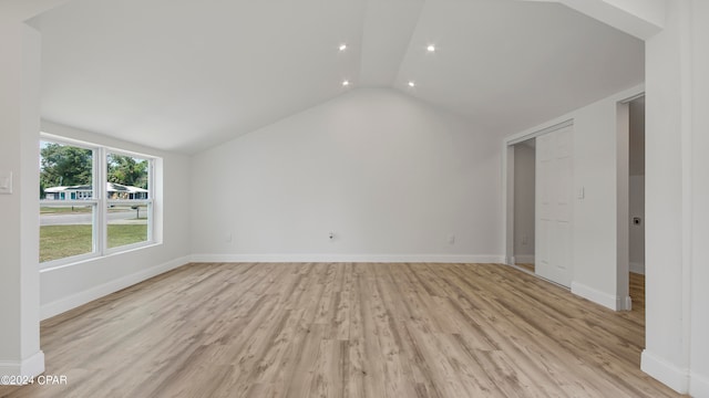 interior space featuring a closet, vaulted ceiling, and light hardwood / wood-style floors