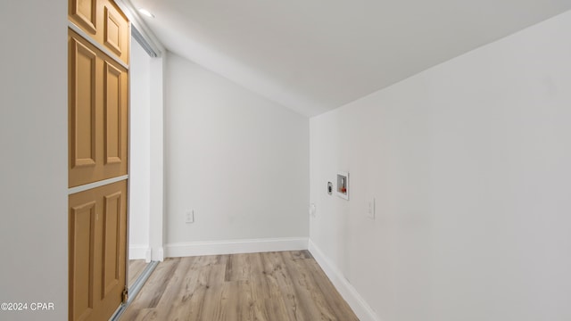 washroom with washer hookup and light hardwood / wood-style floors