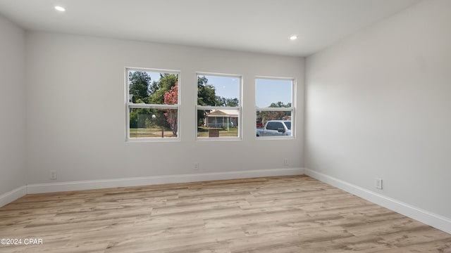 unfurnished room featuring light hardwood / wood-style flooring