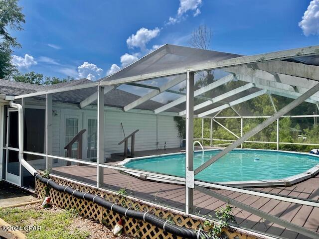 view of pool featuring a lanai