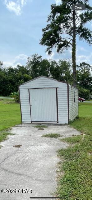 garage with a lawn