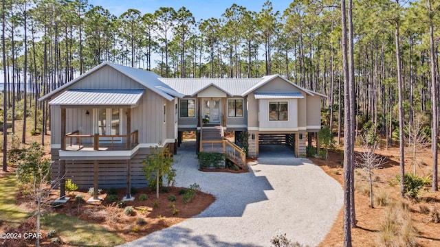 view of front of home featuring a carport and a porch