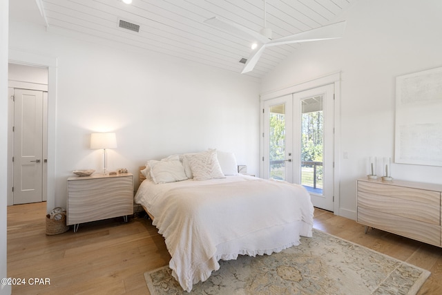 bedroom with french doors, light wood-type flooring, lofted ceiling, access to exterior, and wooden ceiling