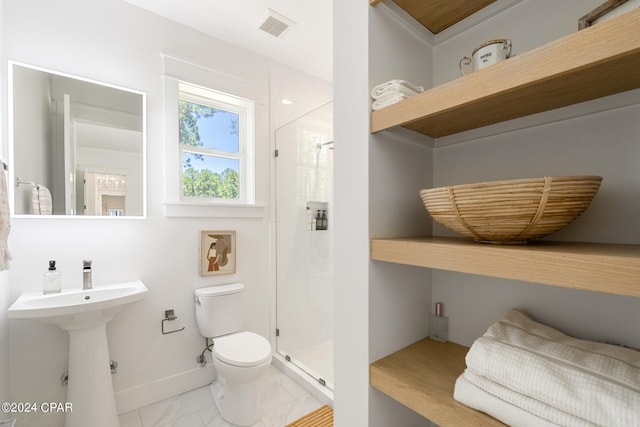 7507 Loons Call Ln, Panama City Beach, FL 32413 - full bath featuring baseboards, a stall shower, toilet, visible vents, and a sink