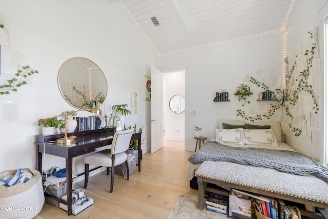 bedroom with high vaulted ceiling, wooden ceiling, and wood-type flooring