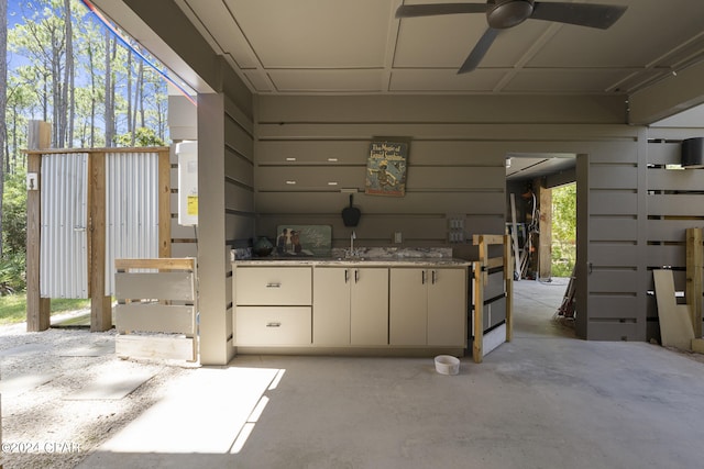 exterior space with ceiling fan