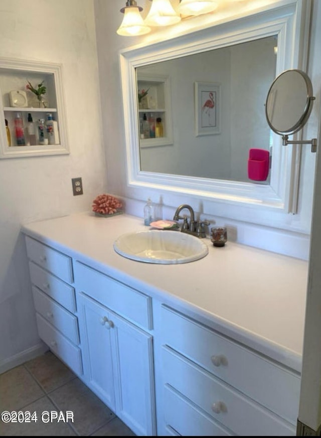 bathroom featuring tile patterned flooring and vanity