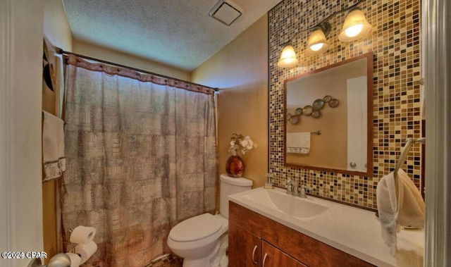 bathroom with toilet, vanity, a textured ceiling, backsplash, and tile walls