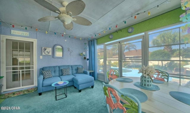 sunroom with a wealth of natural light and ceiling fan