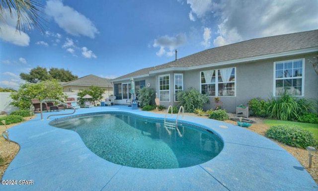 view of swimming pool featuring a patio area