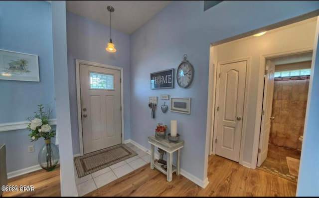 entryway with light hardwood / wood-style flooring