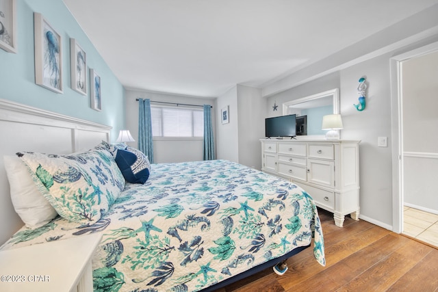 bedroom with wood-type flooring