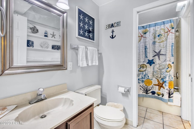 full bathroom featuring shower / bathtub combination with curtain, tile patterned floors, vanity, and toilet