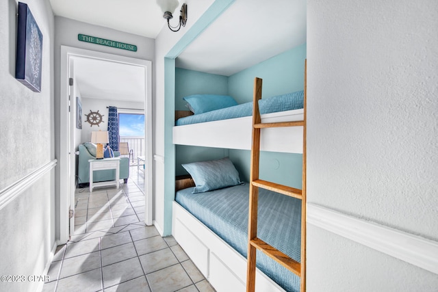 bedroom featuring light tile patterned floors